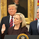 United States Secretary of Homeland Security (DHS) Kirstjen Nielsen, center, administers the oath of citizenship to five people as U.S. President Donald Trump, left, and Vice President Mike Pence, right look on during a naturalization ceremony in the Oval Office of the White House in Washington, DC on Saturday, January 19, 2019.